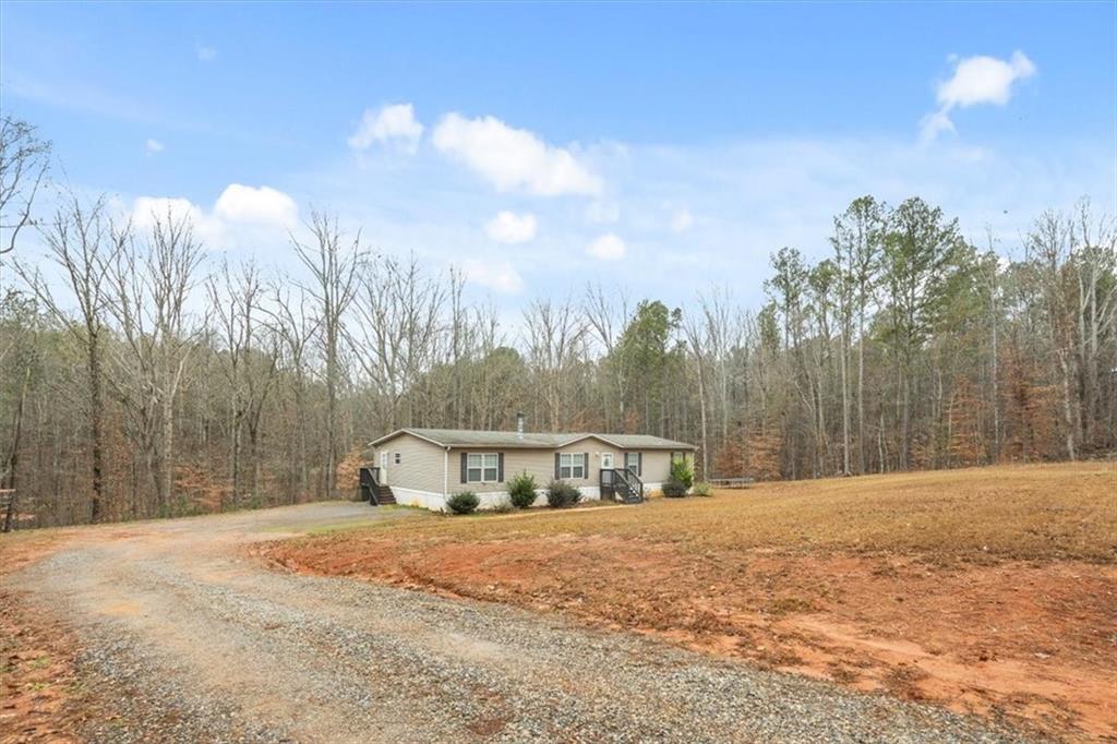 1075 Johnson Brady Road Canton, GA 30115 - Photo 23 of 33 a view of back yard with trees
