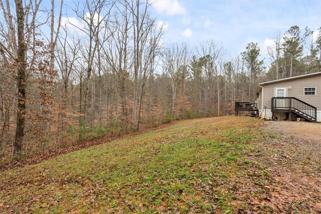 1075 Johnson Brady Road Canton, GA 30115 - Photo 26 of 33 a view of a yard with trees