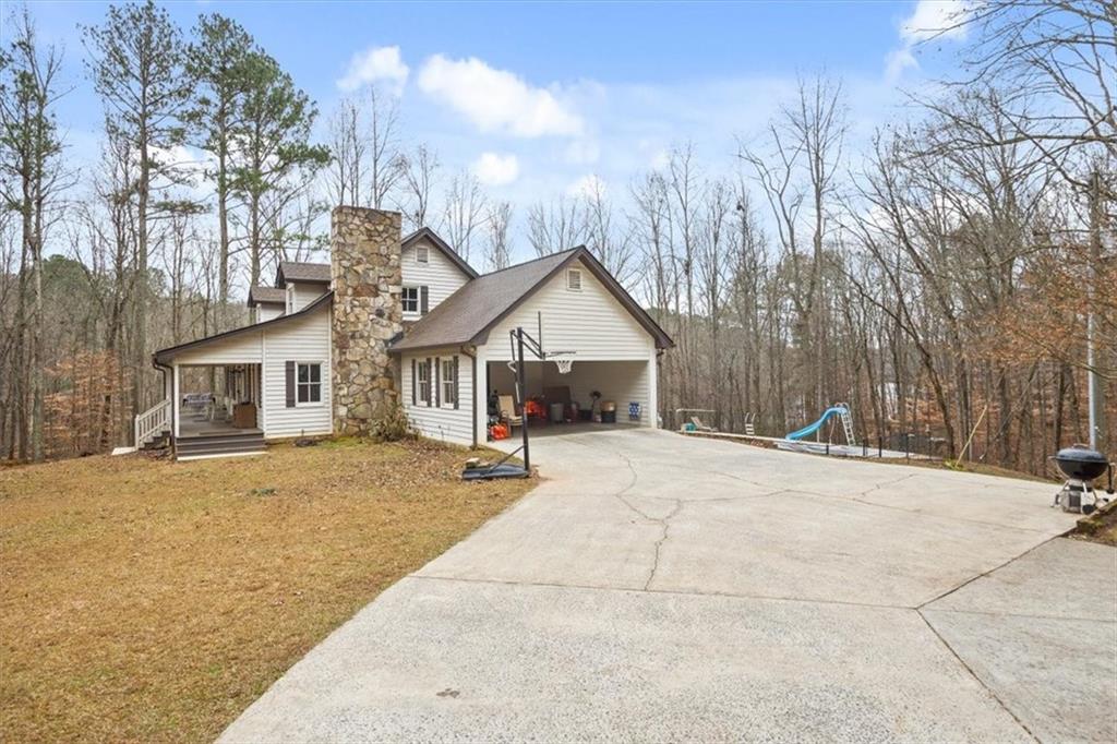 1075 Johnson Brady Road Canton, GA 30115 - Photo 5 of 33 a view of house and outdoor space