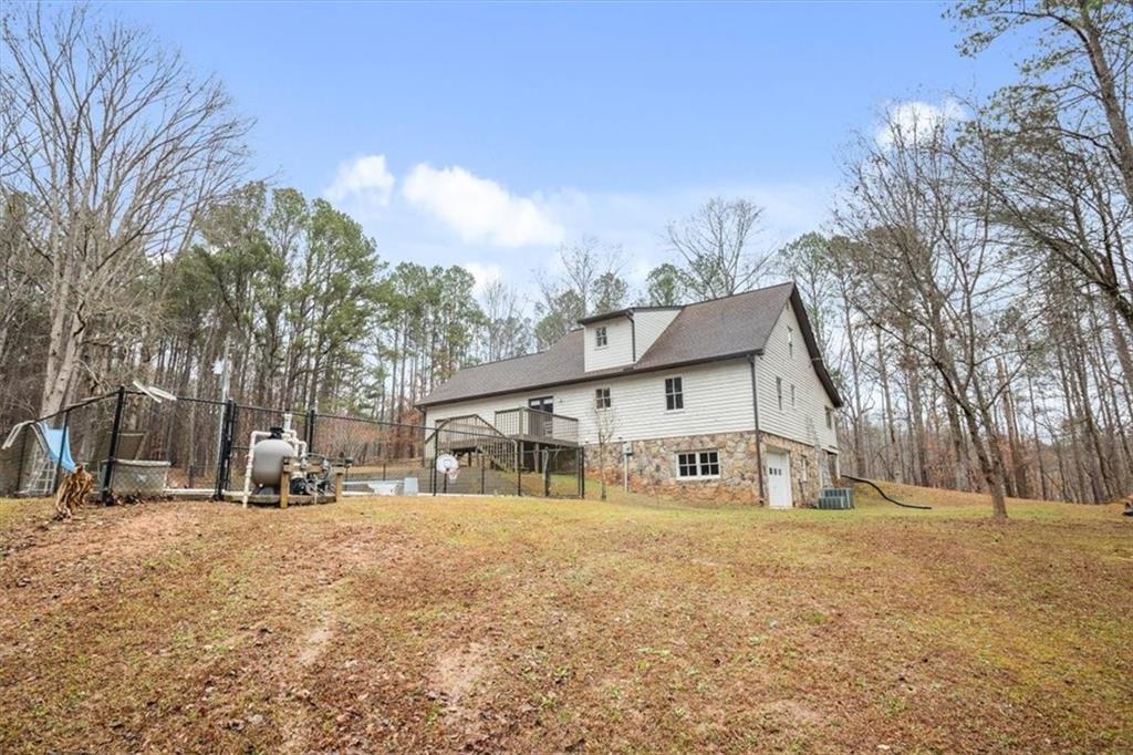 1075 Johnson Brady Road Canton, GA 30115 - Photo 6 of 33 a view of a house with a snow in the yard
