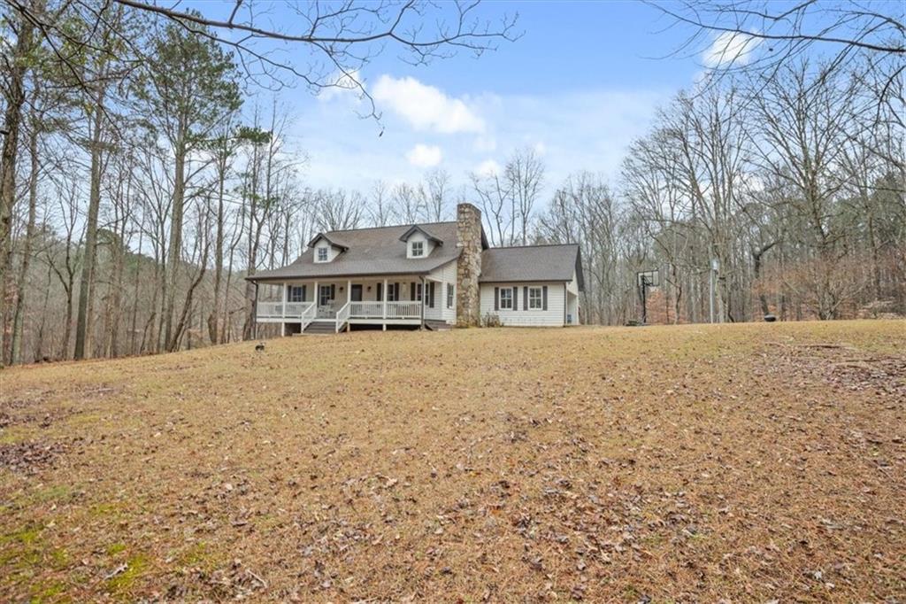 1075 Johnson Brady Road Canton, GA 30115 - Photo 9 of 33 a view of residential houses with yard and covered with snow