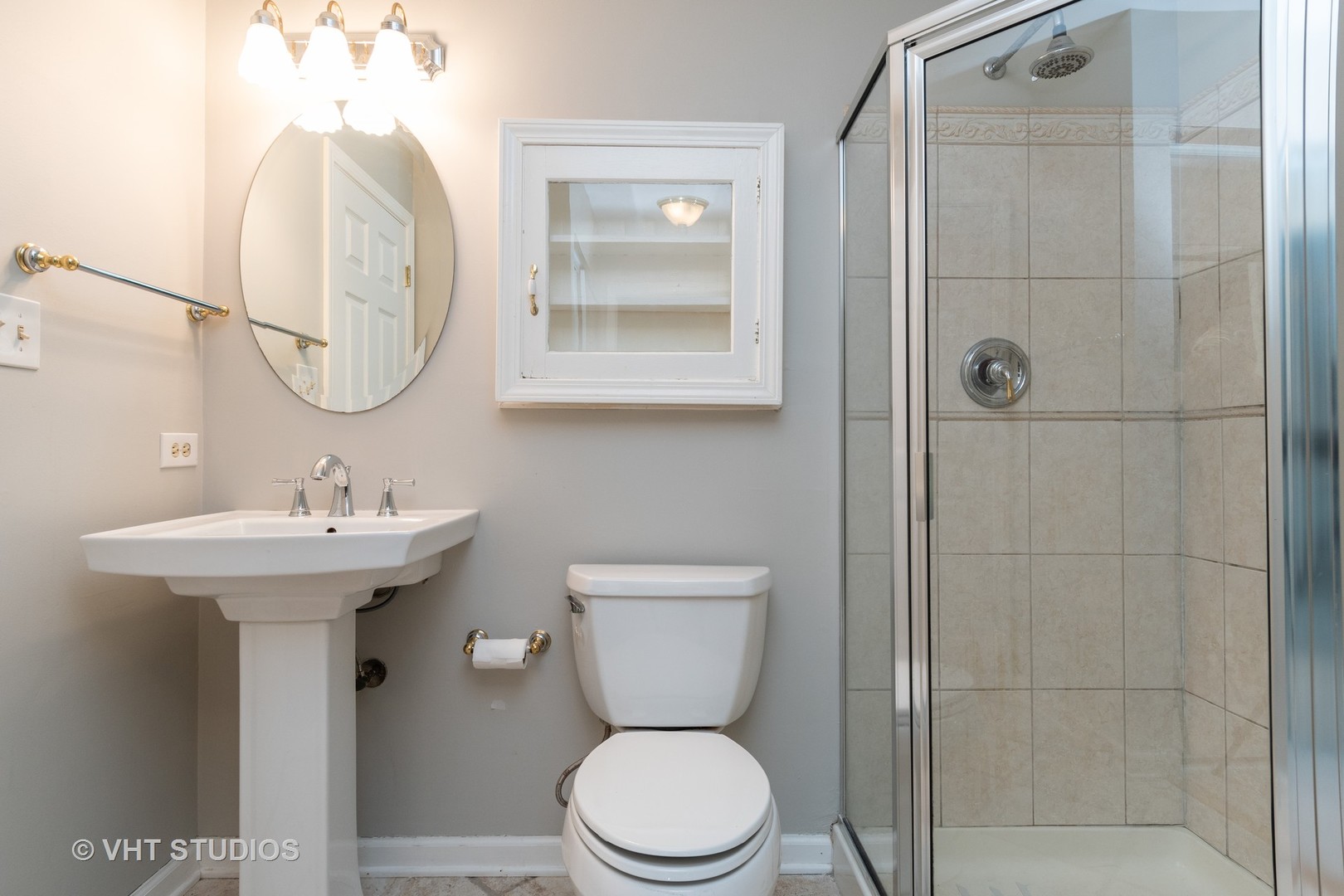 1806 77th Street Naperville, IL 60565 - Photo 8 of 13 a bathroom with a toilet sink and mirror