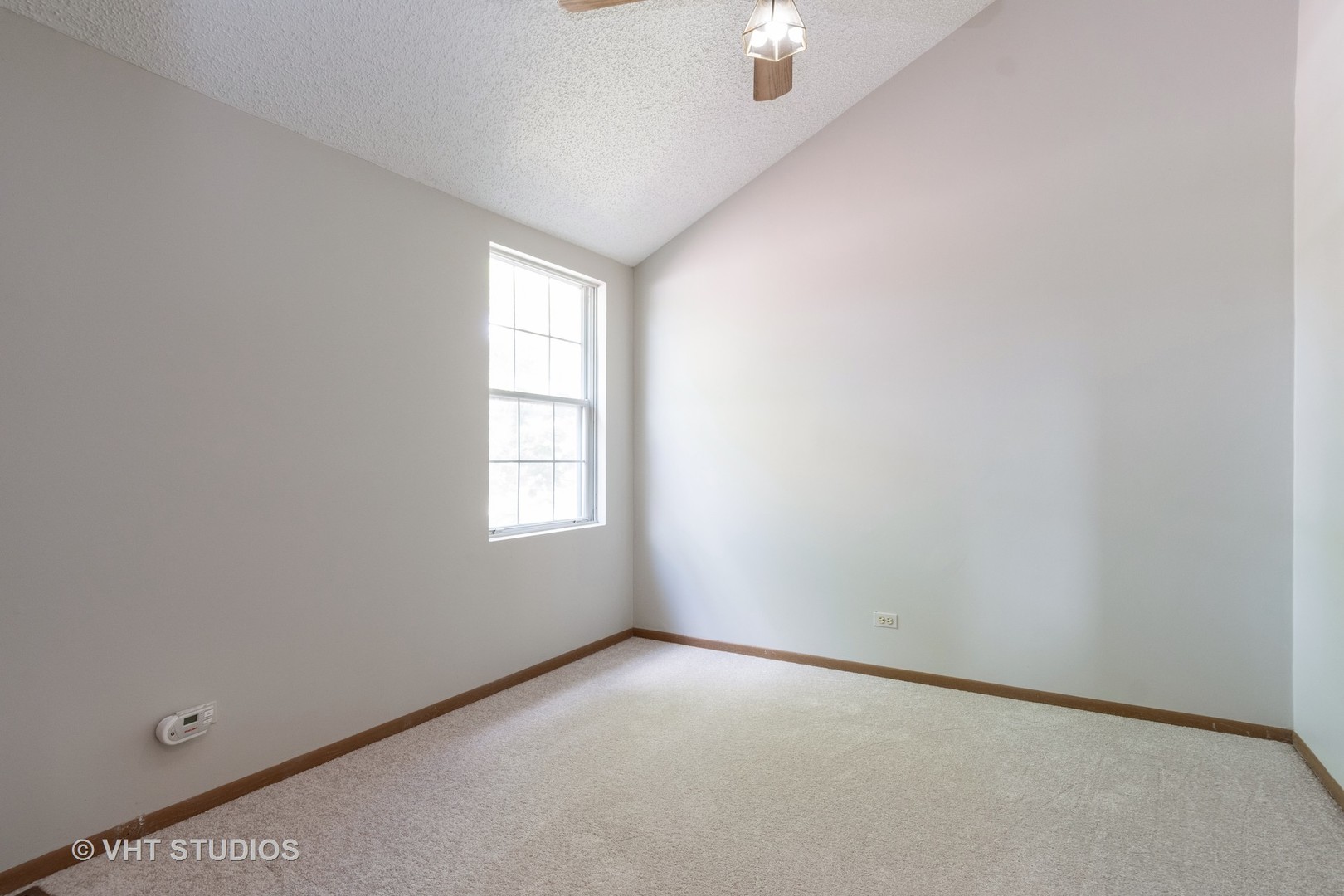 1806 77th Street Naperville, IL 60565 - Photo 10 of 13 an empty room with a window