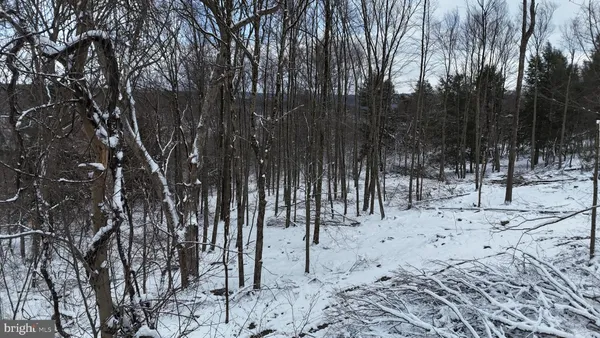a view of a covered with snow in the yard