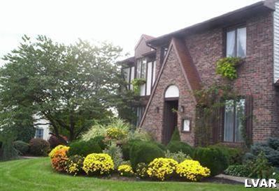 3215 Darien Road Bethlehem, PA 18020 - Photo 4 of 31 Front View with all the Golden Yellowish Hardy Mums.