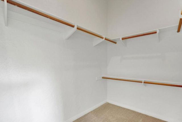 a view of a balcony with wooden floor and city view