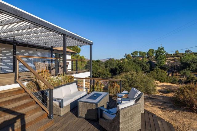 a view of house with yard and green space