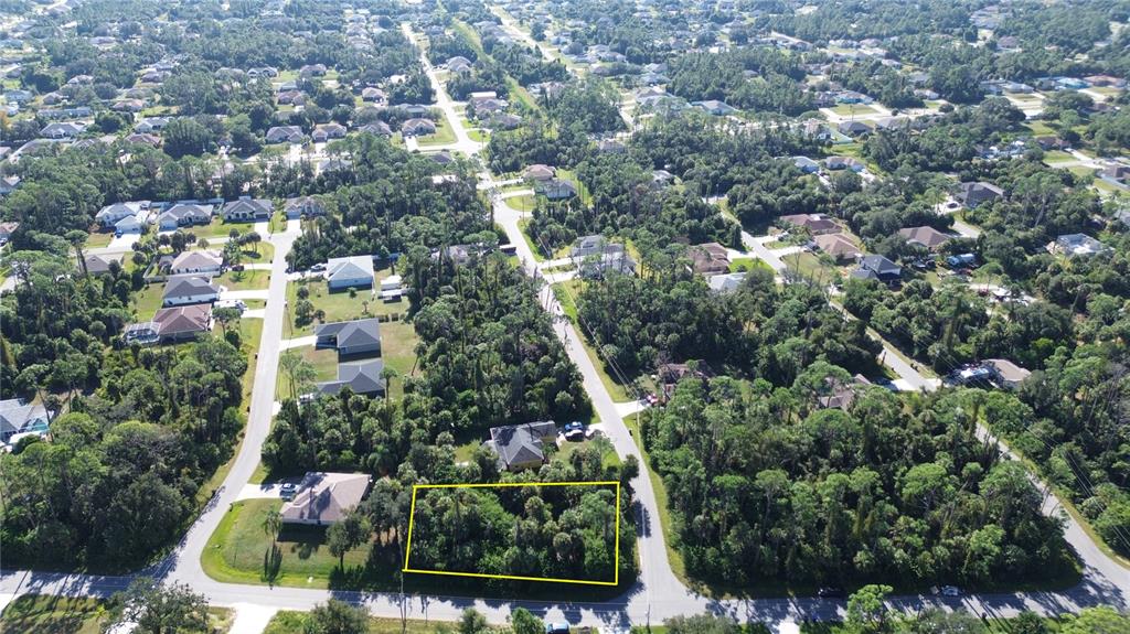 Alfred Rd Port North Port, FL 34286 - Photo 1 of 8 an aerial view of residential house with outdoor space and trees all around