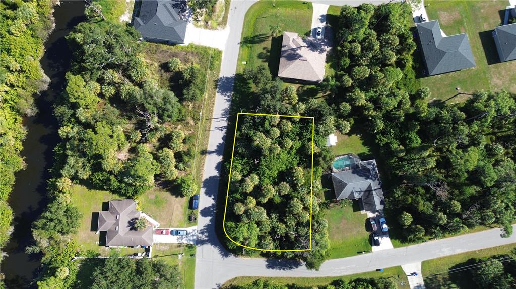 Alfred Rd Port North Port, FL 34286 - Photo 5 of 8 an aerial view of a house a yard and lake view