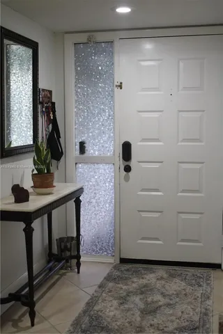 a living room with a flat screen tv and a fireplace