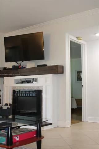 a spacious bedroom with a bed and wooden floor