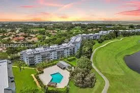 a view of a lake with houses in the back