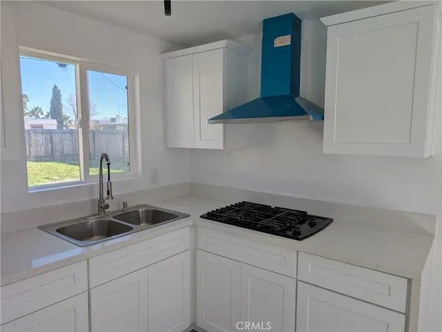 a close view of sink a faucet and a faucet next to a window