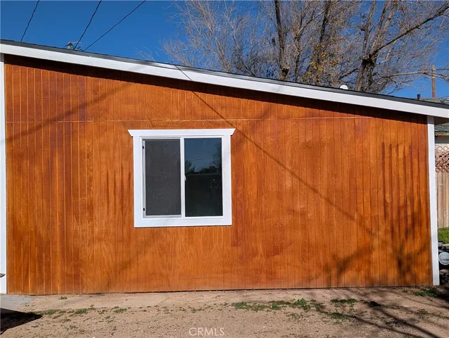 a view of a backyard of the house