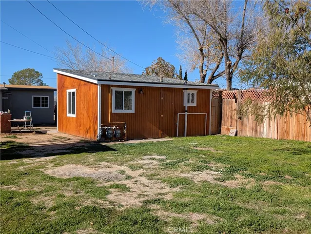 a view of a backyard of the house