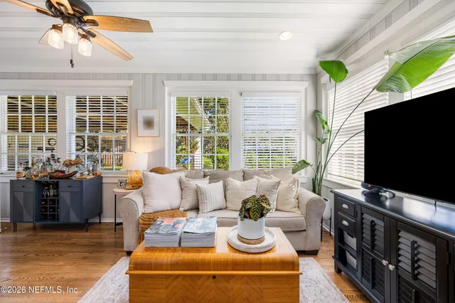 a living room with furniture and a flat screen tv