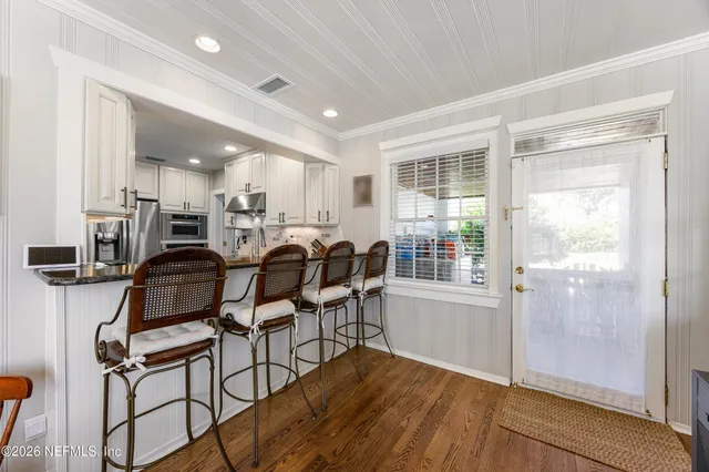 a view of a dining room with furniture window and outside view