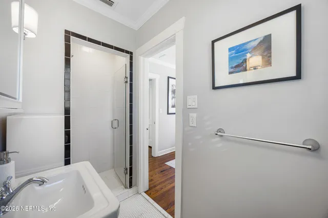 a bathroom with a tub and shower