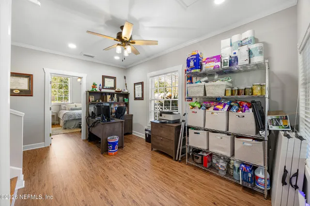 a living room with furniture and a gym equipment