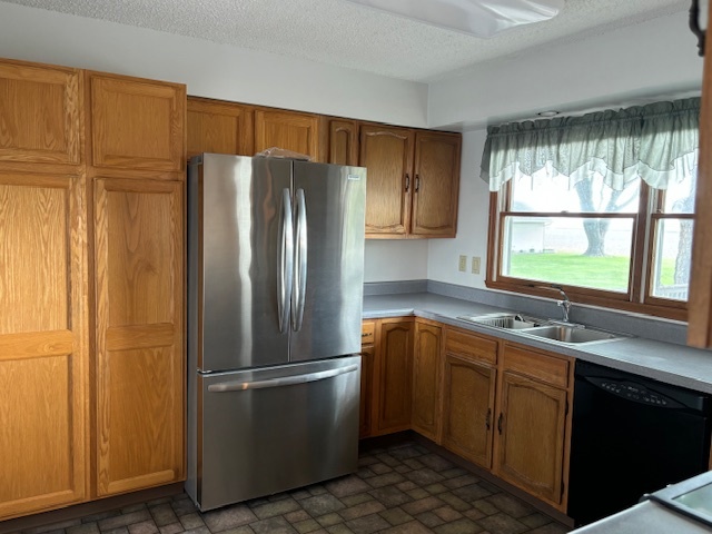 5287 South Mill Pond Road Rochelle, IL 61068 - Photo 14 of 50 a kitchen with a refrigerator and a sink