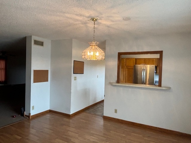 5287 South Mill Pond Road Rochelle, IL 61068 - Photo 17 of 50 a view of a room with wooden floor and chandelier