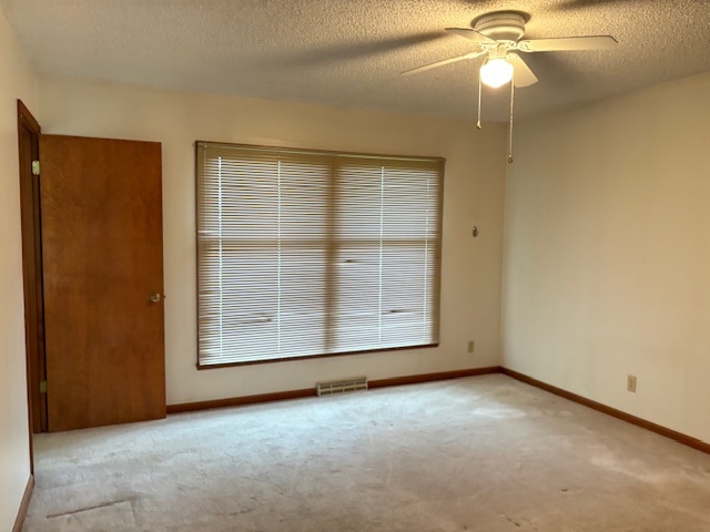 5287 South Mill Pond Road Rochelle, IL 61068 - Photo 21 of 50 an empty room with windows and fan