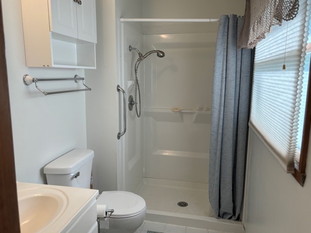 5287 South Mill Pond Road Rochelle, IL 61068 - Photo 26 of 50 a white toilet sitting next to a bathroom sink
