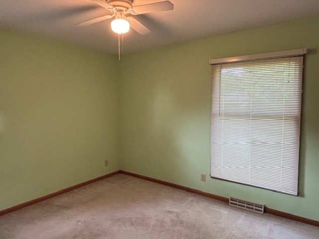 5287 South Mill Pond Road Rochelle, IL 61068 - Photo 29 of 50 an empty room with a window and a fan