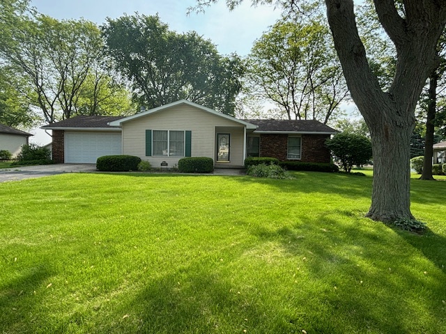 5287 South Mill Pond Road Rochelle, IL 61068 - Photo 3 of 50 a view of a house with a yard and large trees