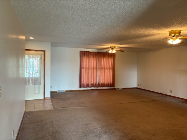 5287 South Mill Pond Road Rochelle, IL 61068 - Photo 5 of 50 an empty room with a empty space and windows