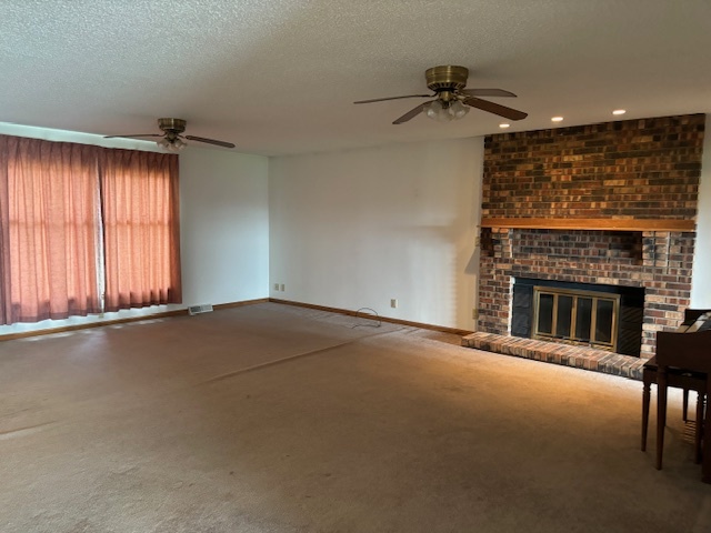 5287 South Mill Pond Road Rochelle, IL 61068 - Photo 8 of 50 an empty room with a fireplace and windows