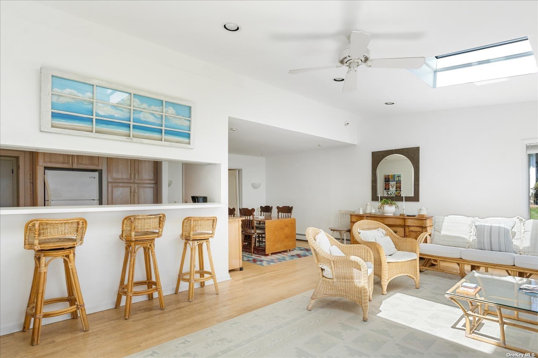 1155 Old Harbor Road New Suffolk, NY 11956 - Photo 11 of 21 a living room with furniture and a window