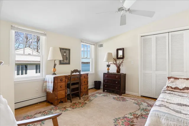a bedroom with furniture and a window