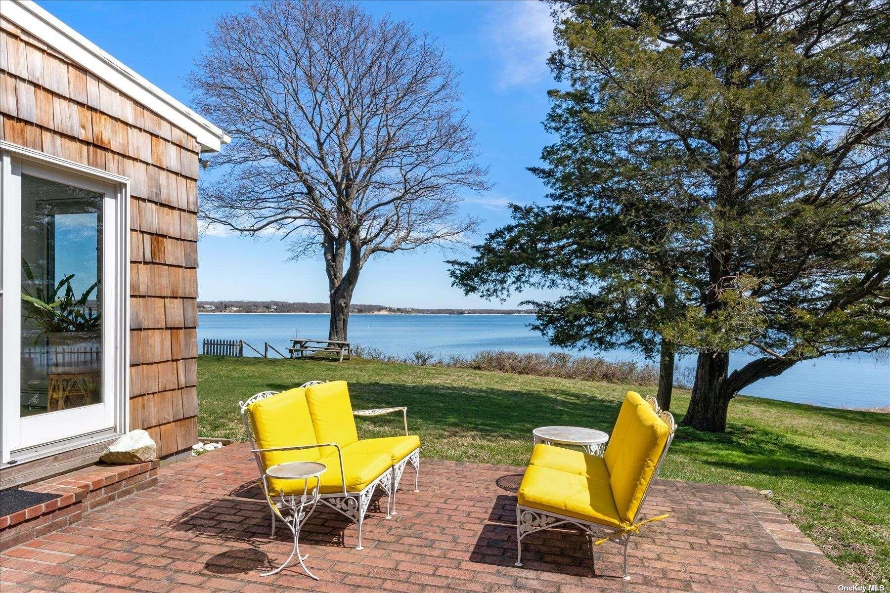 1155 Old Harbor Road New Suffolk, NY 11956 - Photo 3 of 21 a view of a swimming pool with a lounge chairs