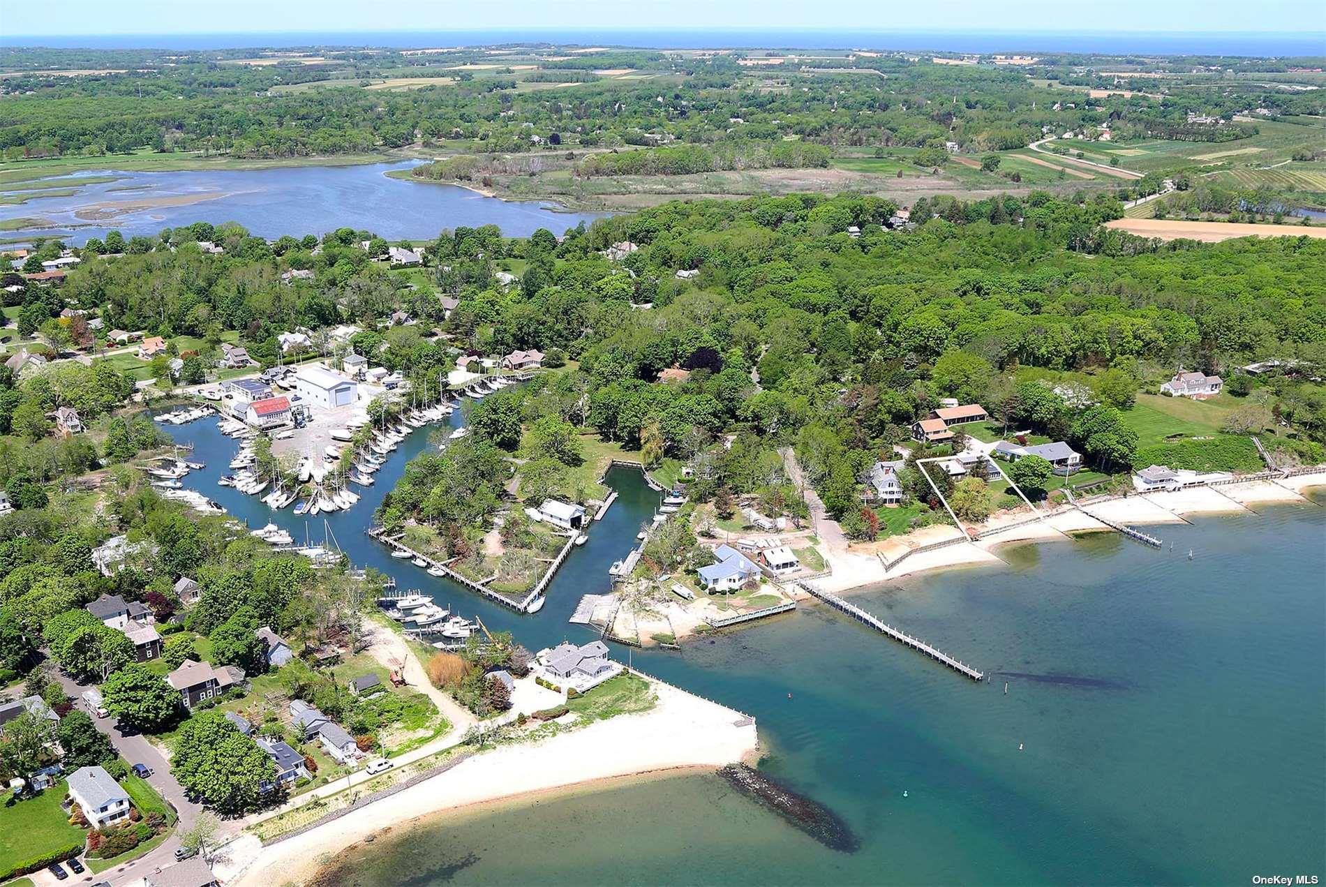 1155 Old Harbor Road New Suffolk, NY 11956 - Photo 4 of 21 a view of a lake with a city