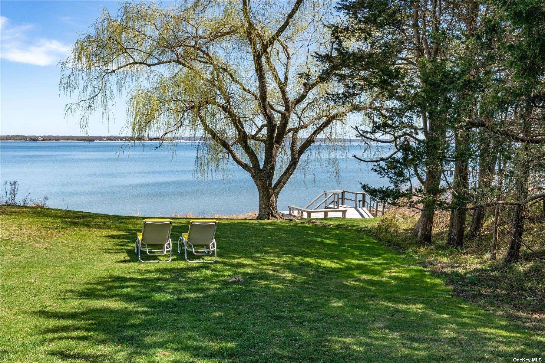 1155 Old Harbor Road New Suffolk, NY 11956 - Photo 6 of 21 a view of a backyard