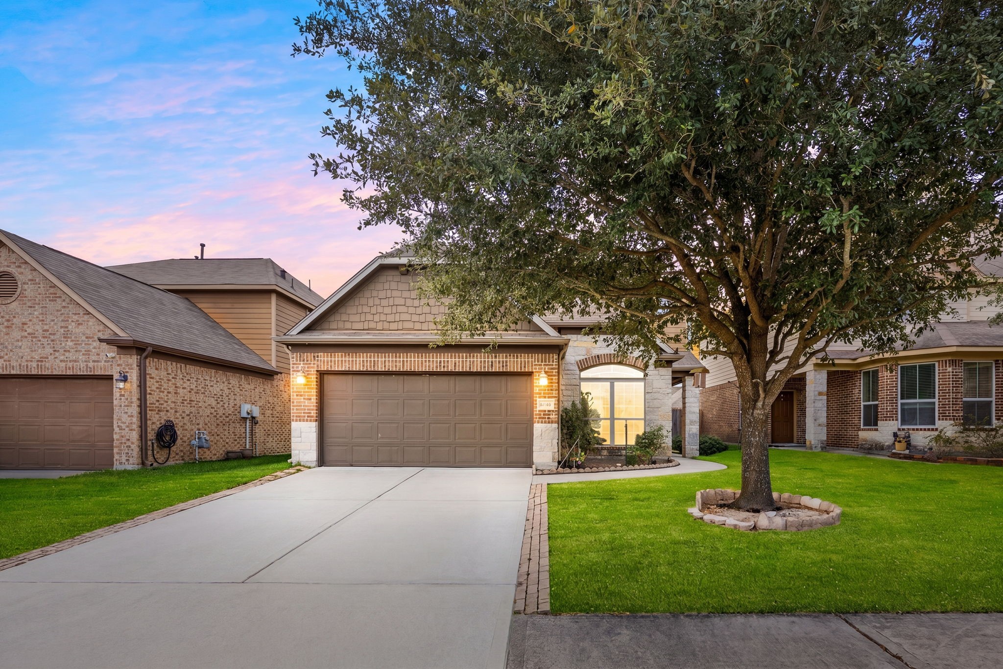 29322 Indian Clearing Spring, TX 77386 - Photo 6 of 47 a front view of a house with a garden