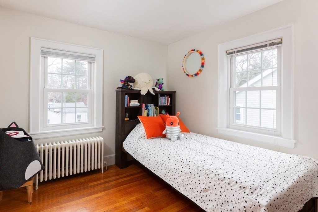 113 Payson Road Brookline, MA 02467 - Photo 13 of 16 a bedroom with a bed and window
