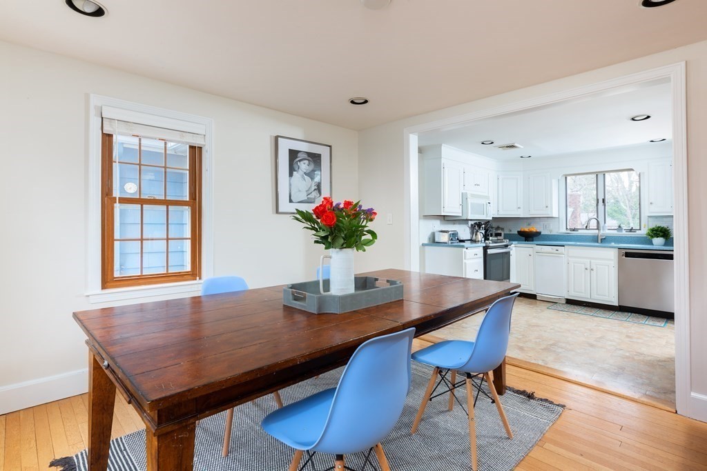 113 Payson Road Brookline, MA 02467 - Photo 5 of 16 a view of a dining room with furniture and wooden floor