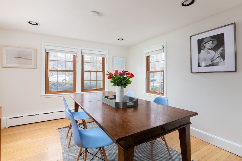 113 Payson Road Brookline, MA 02467 - Photo 6 of 16 a dining room with furniture and wooden floor