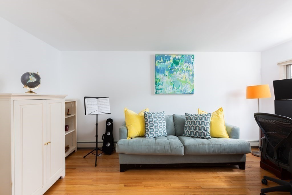 113 Payson Road Brookline, MA 02467 - Photo 10 of 16 a living room with furniture and a couch