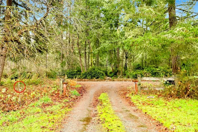 a view of a yard with an ocean view