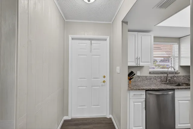a kitchen with a sink and cabinets