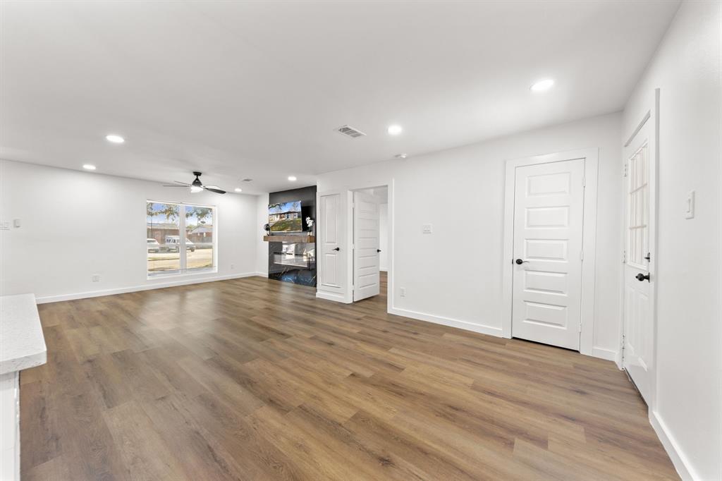3227 Mayhew Drive Dallas, TX 75228 - Photo 13 of 25 a view of an empty room with a cabinet and a window