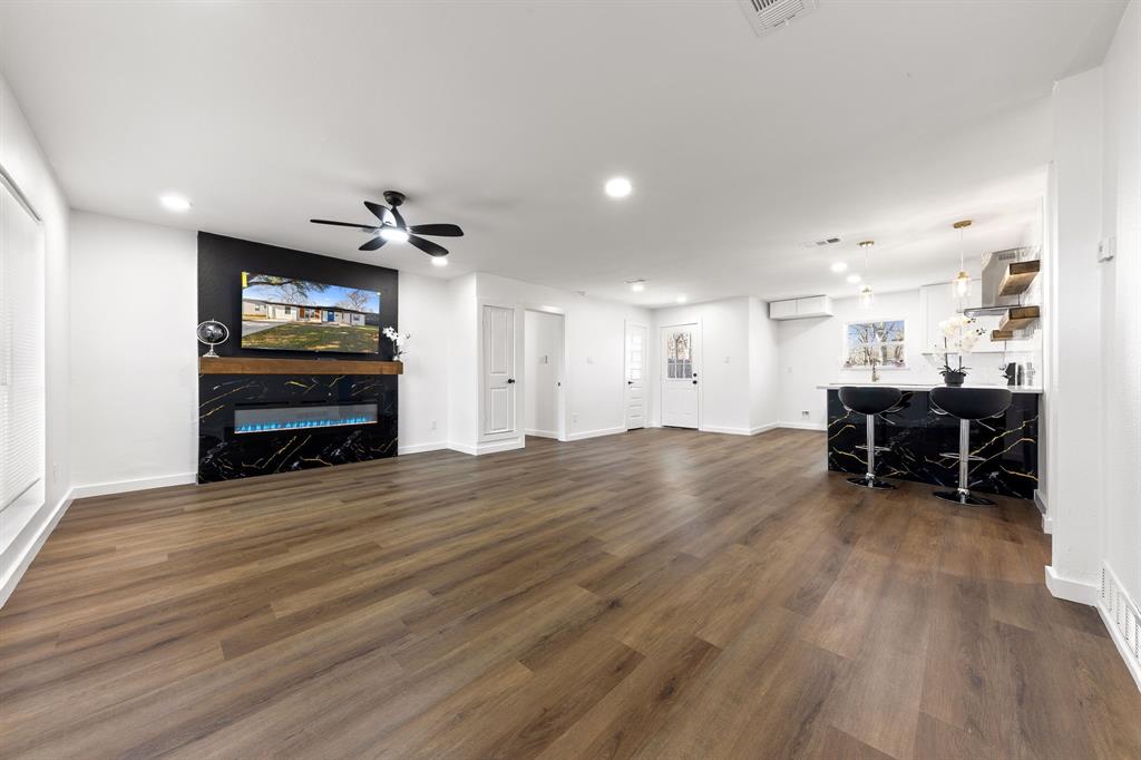 3227 Mayhew Drive Dallas, TX 75228 - Photo 4 of 25 a view of kitchen with furniture and a wooden floor
