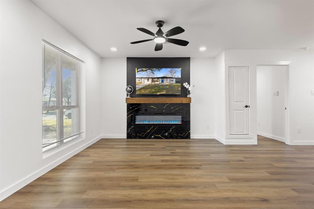 3227 Mayhew Drive Dallas, TX 75228 - Photo 5 of 25 a view of fireplace and wooden floor
