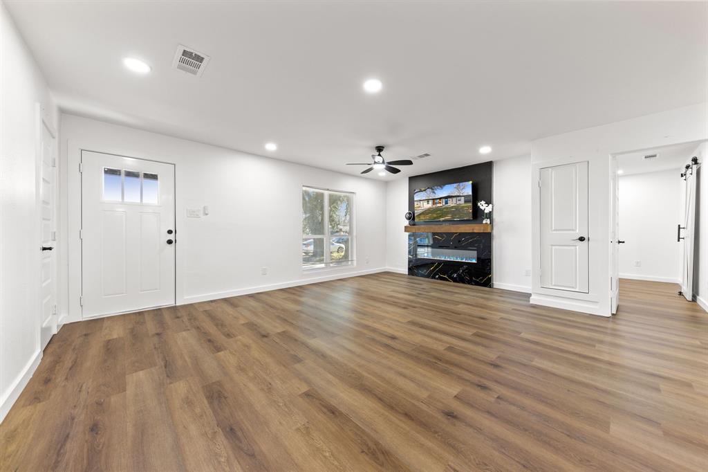 3227 Mayhew Drive Dallas, TX 75228 - Photo 6 of 25 a view of empty room with wooden floor