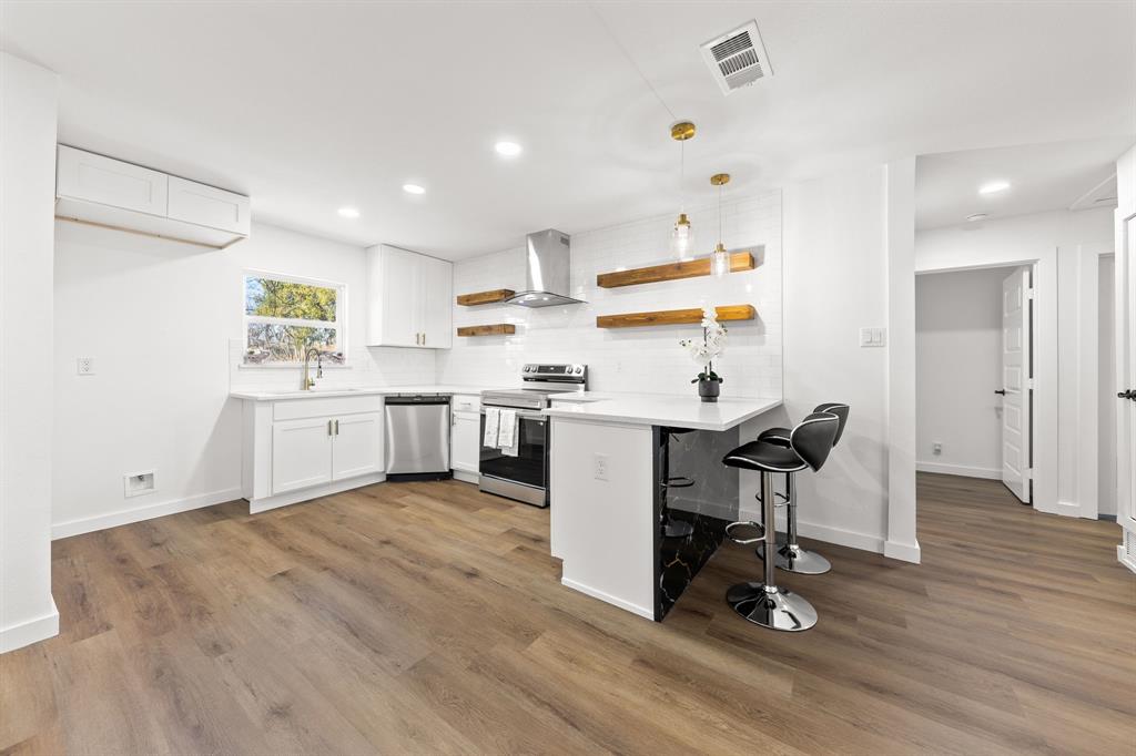 3227 Mayhew Drive Dallas, TX 75228 - Photo 10 of 25 a view of workspace with wooden floor