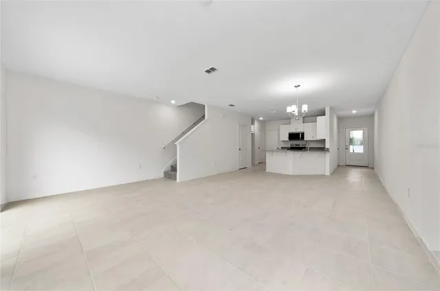 a view of a kitchen with a sink and a stove top oven