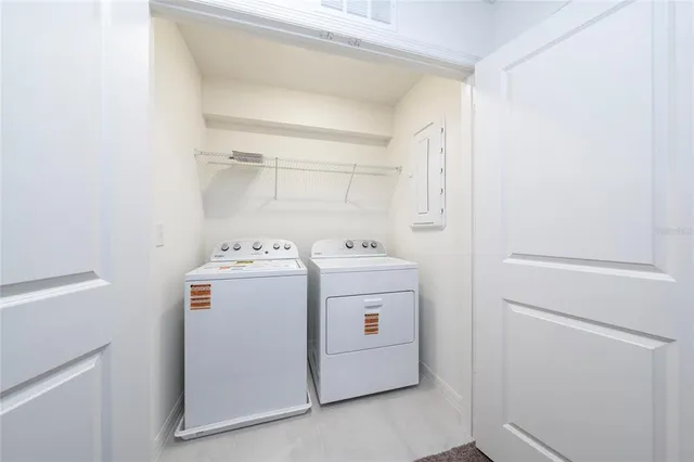 a utility room with dryer and washer